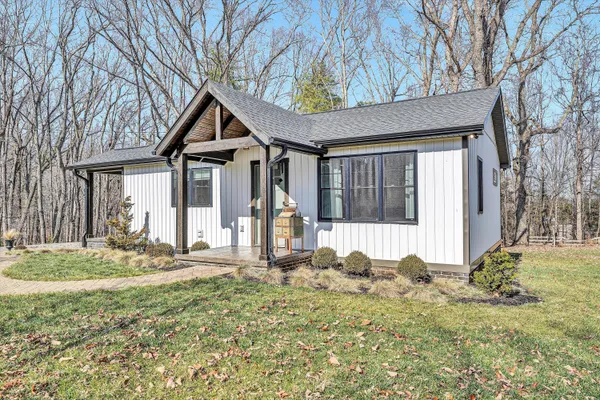 a house with trees in the background