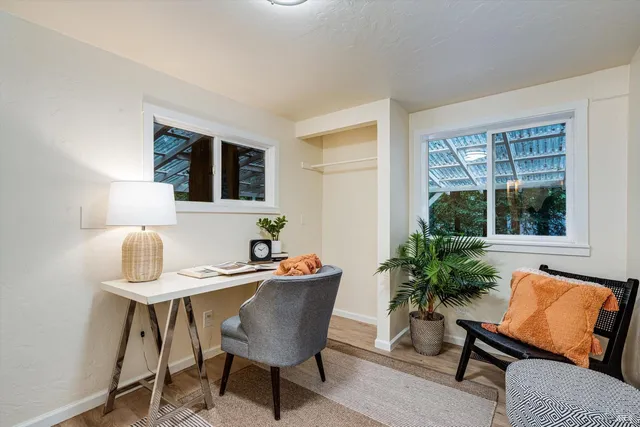 a dining room with furniture and window
