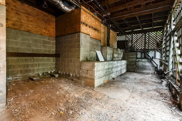 a view of a room with wooden walls