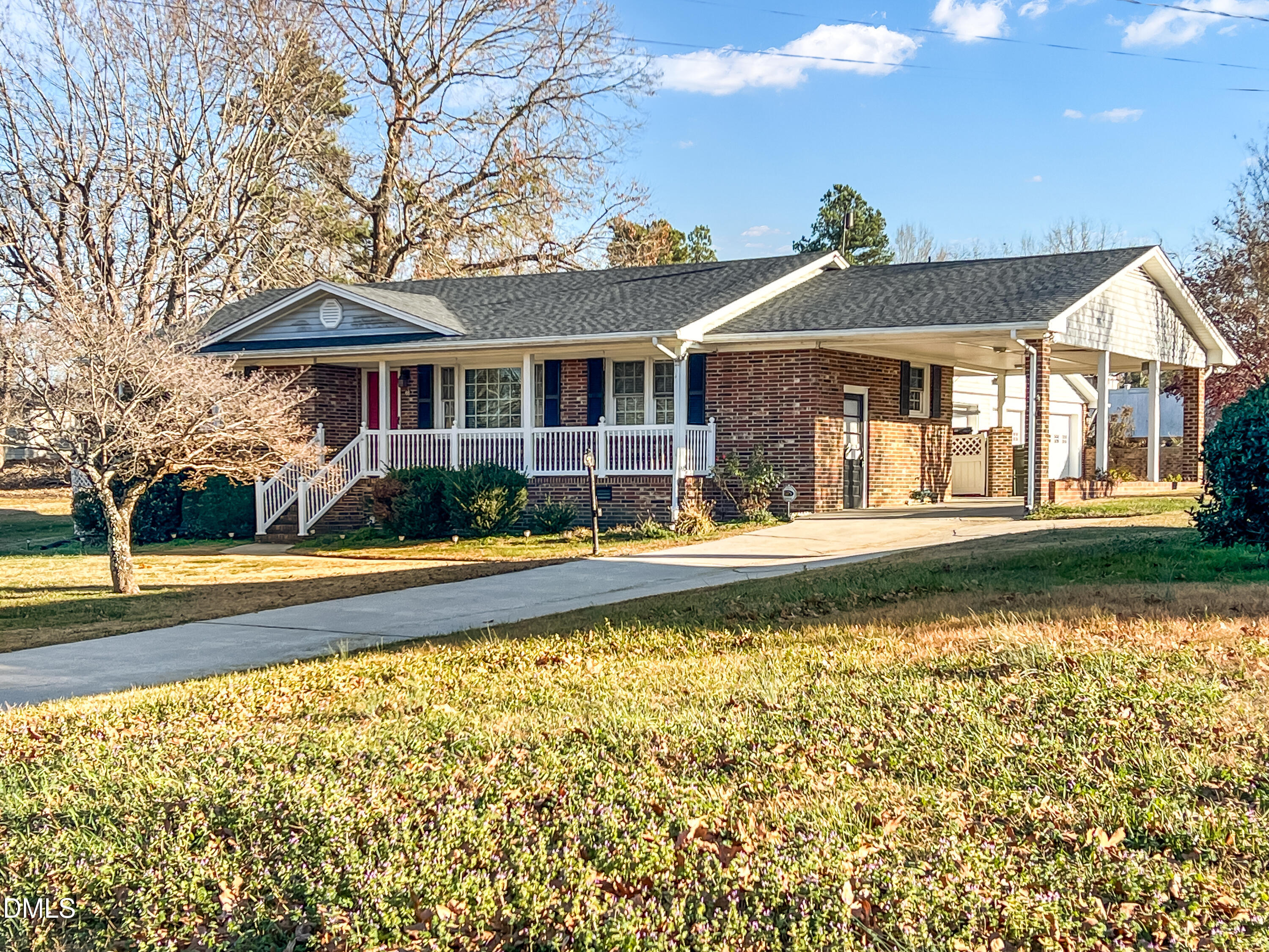 a front view of a house with swimming pool having outdoor seating