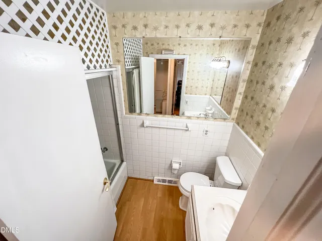 an empty room with windows and entrance