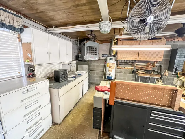 a view of a kitchen and workspace