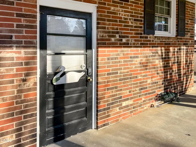 a view of a door and a window