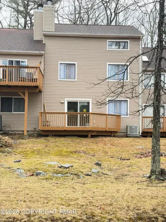 a kitchen with stainless steel appliances dining table and chairs