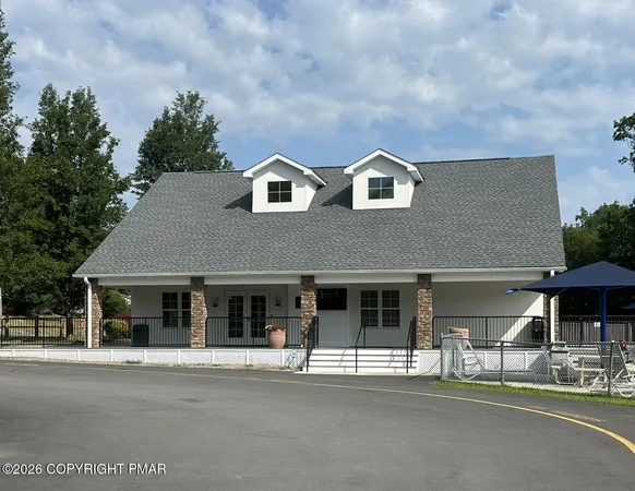a view of a swimming pool and lounge chair