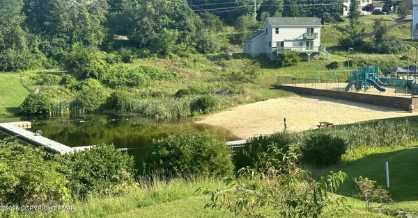 a view of an outdoor space and tennis court
