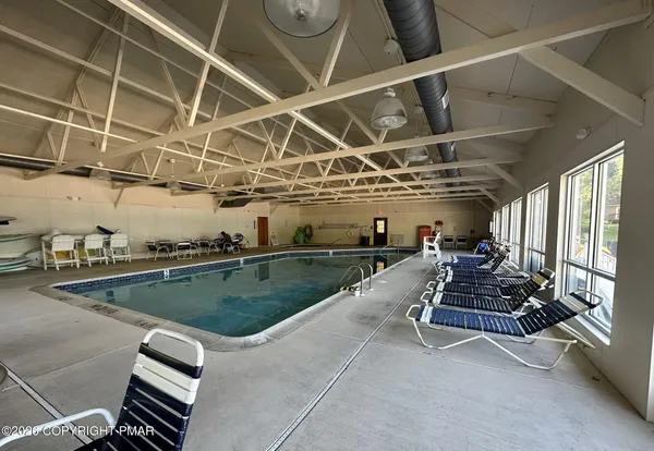 a room with gym equipment and windows