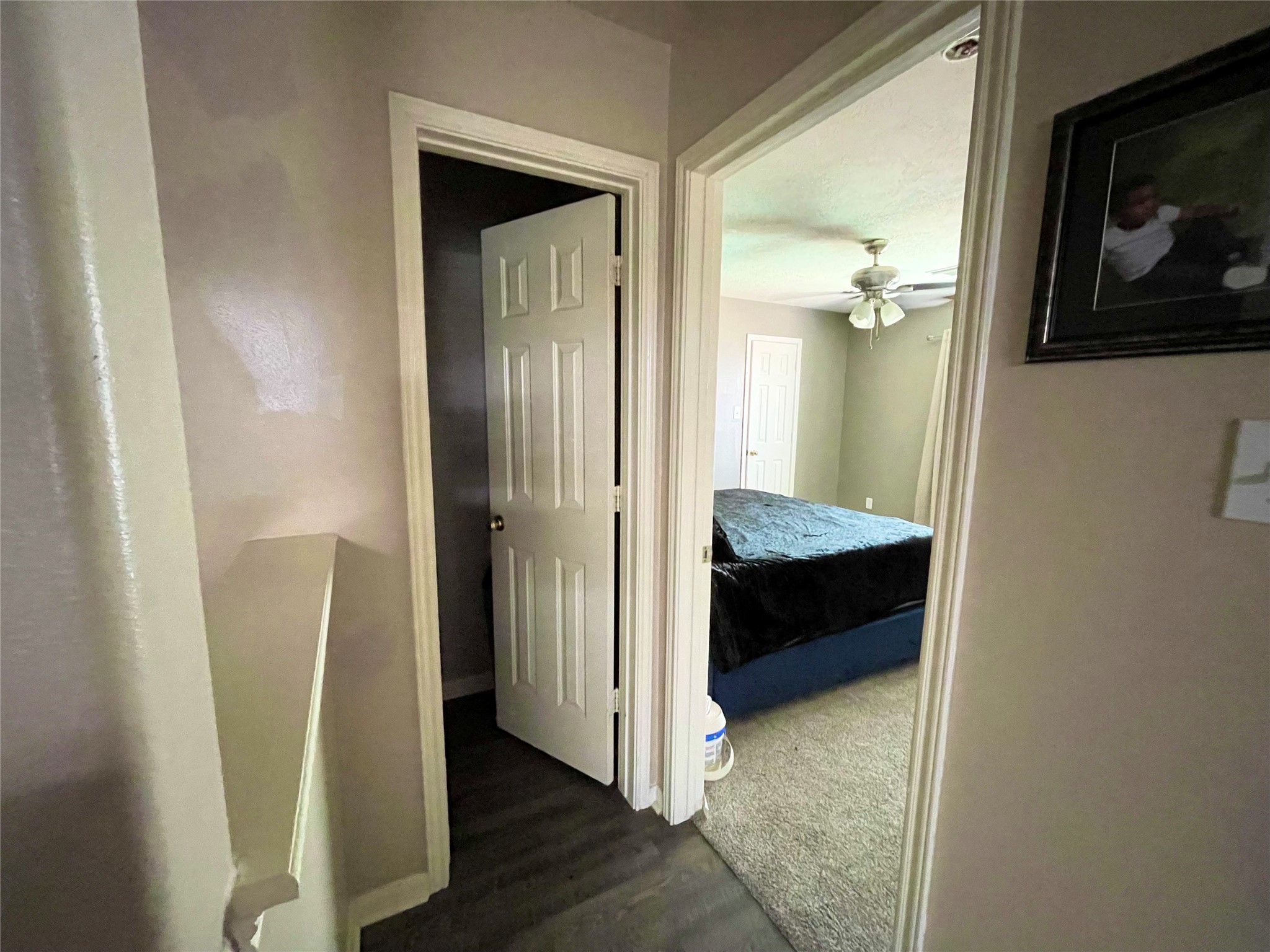 a view of a hallway with a room and a livingroom