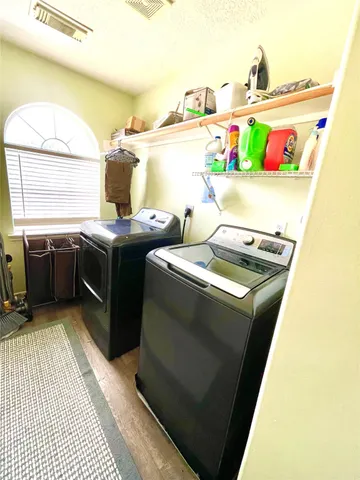 a utility room with washer and dryer