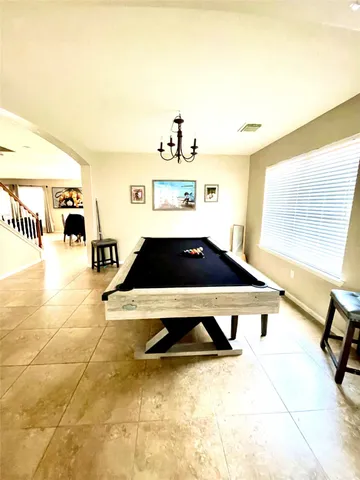 a living room with a table and chairs