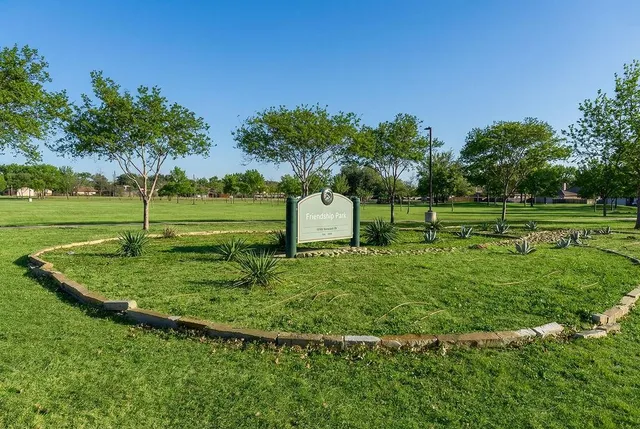 a view of a golf course with a lake
