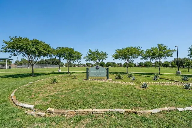 a view of a park with swings and slides