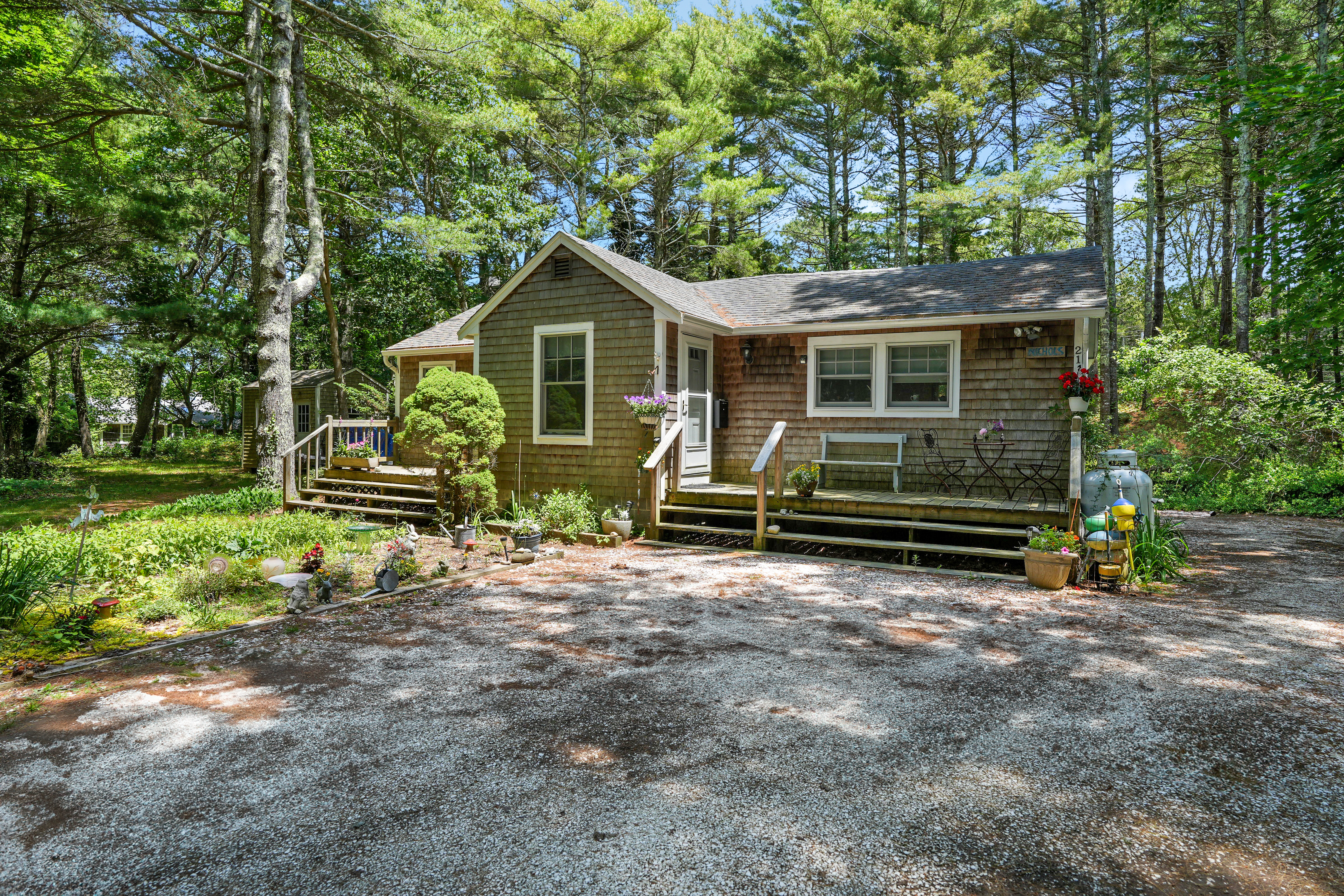 a front view of a house with garden