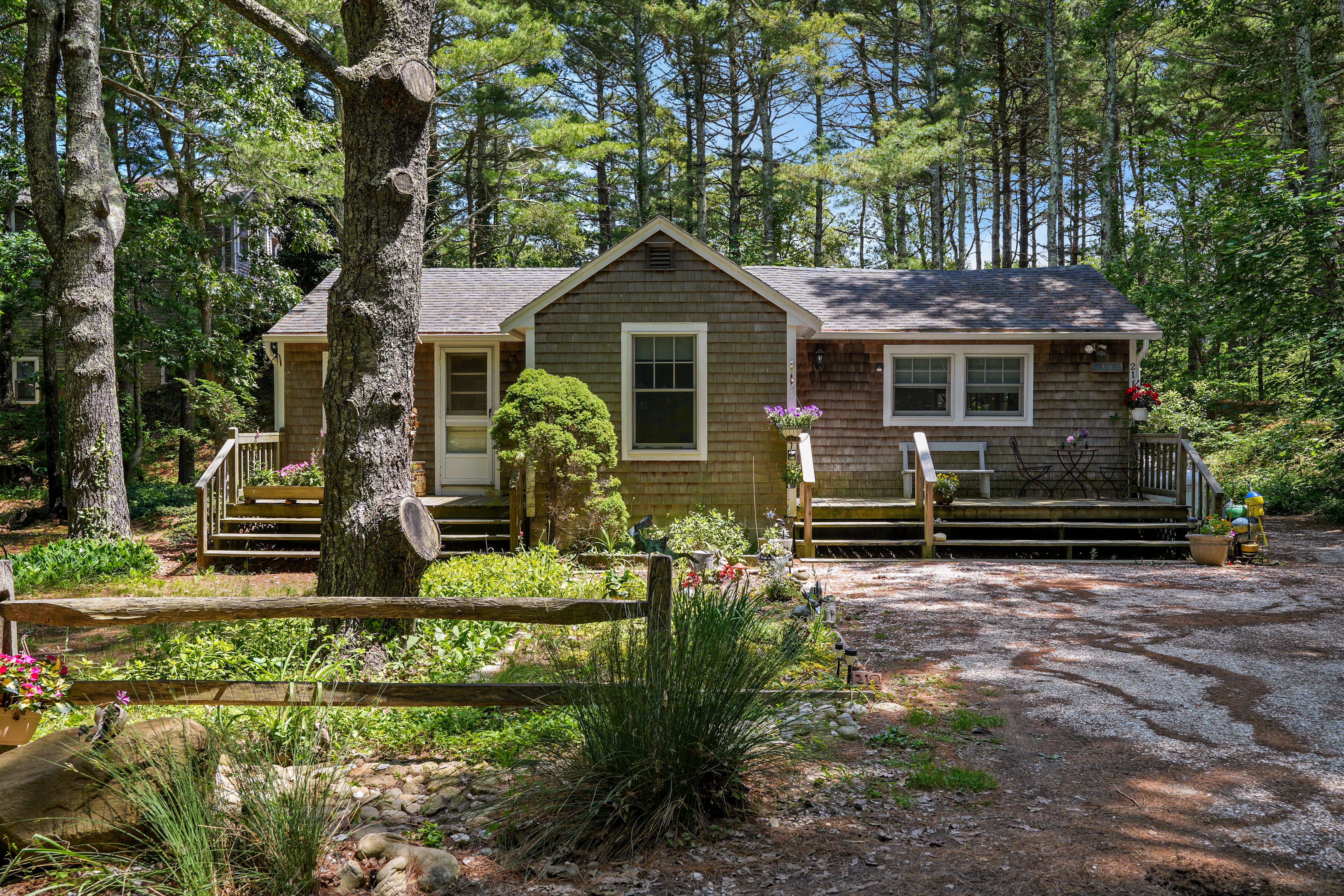 21 Clay Pit Road Edgartown, MA 02539 - Photo 19 of 20 a front view of house with yard and green space