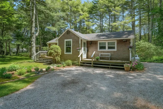 a front view of a house with a yard