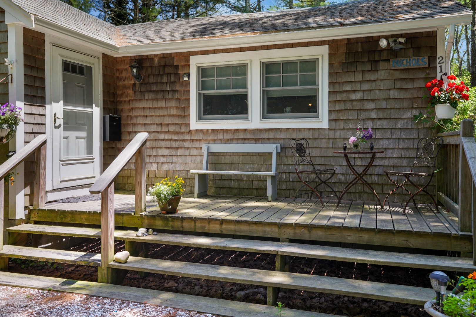 21 Clay Pit Road Edgartown, MA 02539 - Photo 4 of 20 a front view of a house with a garden