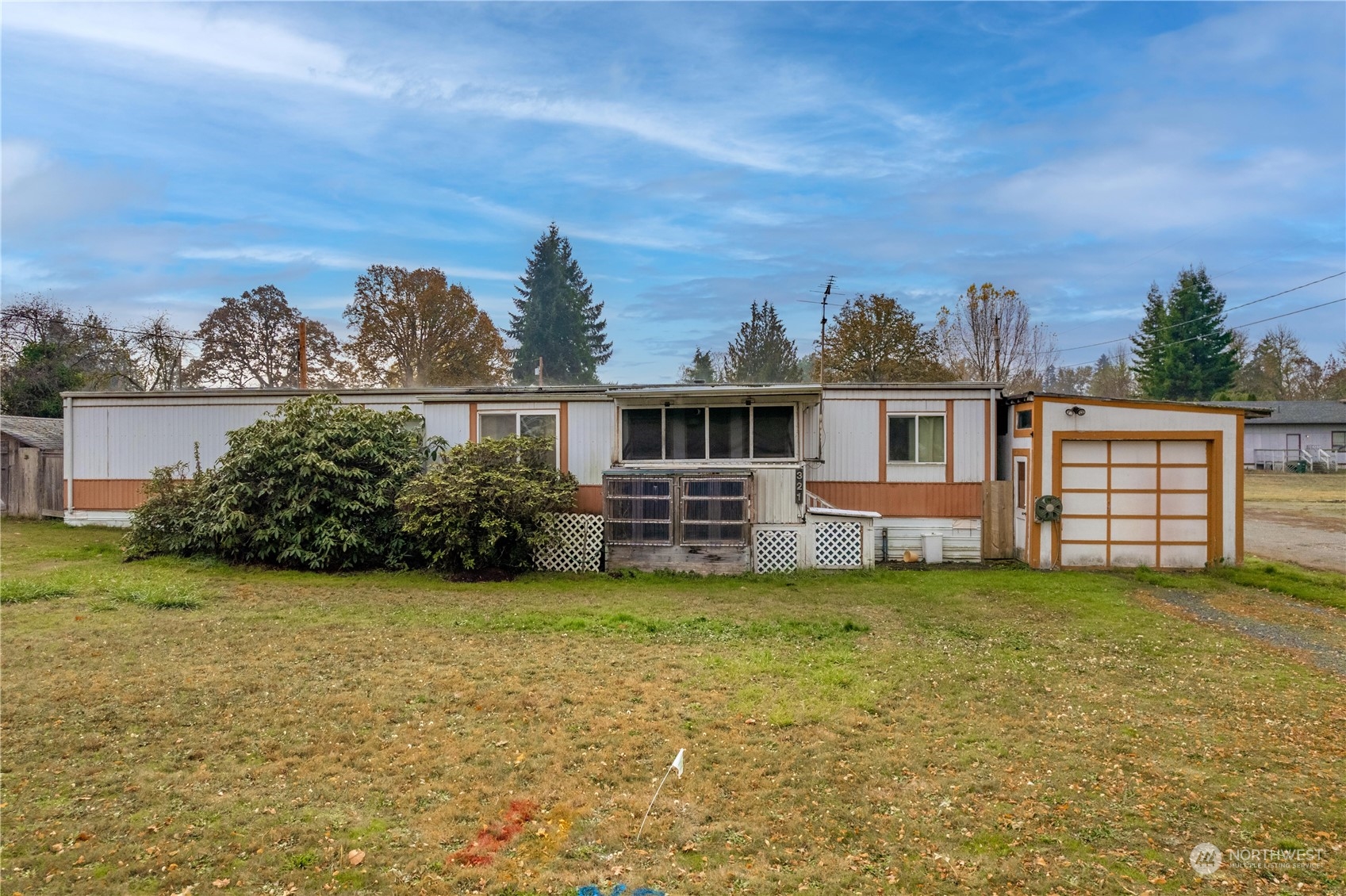 321 2nd Street Roy, WA 98580 - Photo 1 of 16 a view of a house with a yard and sitting area