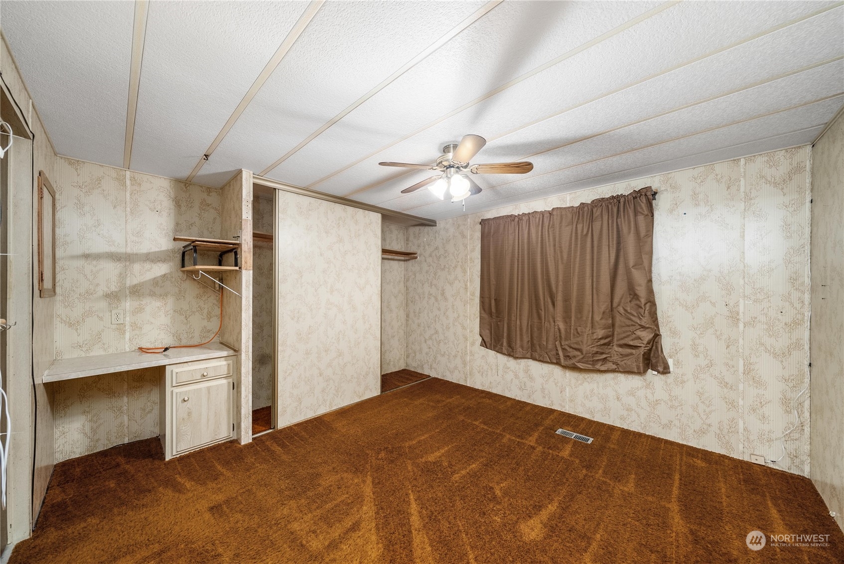 321 2nd Street Roy, WA 98580 - Photo 13 of 16 a bedroom with a bed and a chandelier