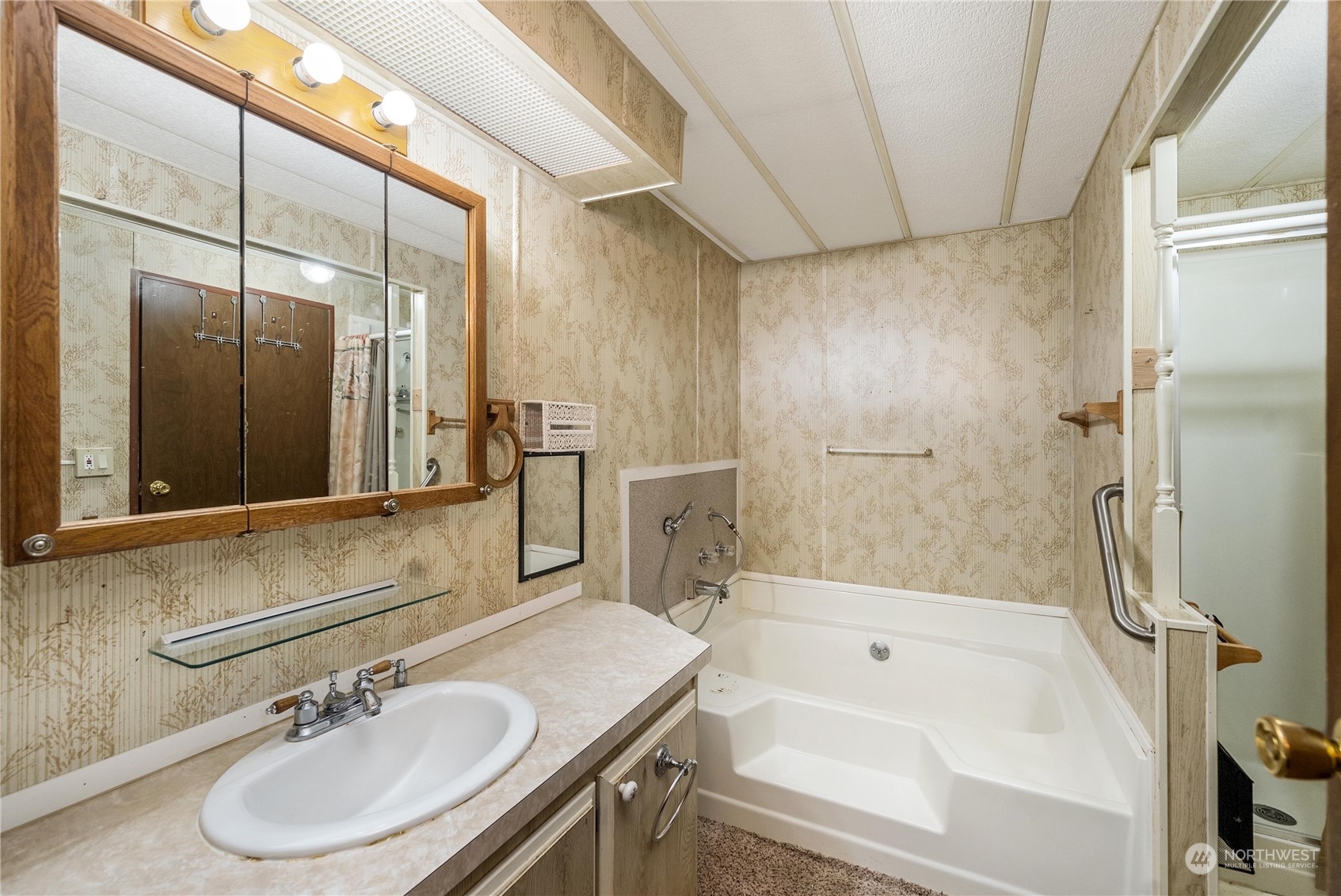 321 2nd Street Roy, WA 98580 - Photo 14 of 16 a bathroom with a sink and a mirror