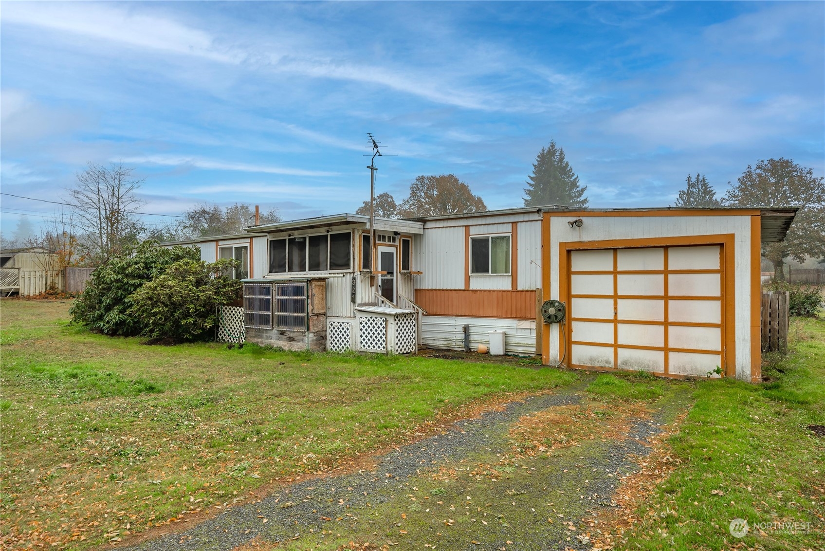 321 2nd Street Roy, WA 98580 - Photo 15 of 16 front view of a house with a yard