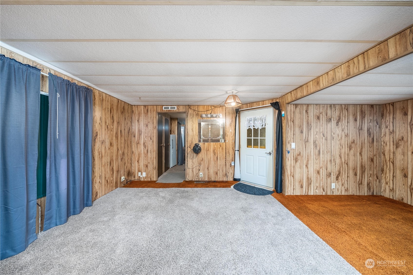 321 2nd Street Roy, WA 98580 - Photo 6 of 16 a view of large room with wooden walls
