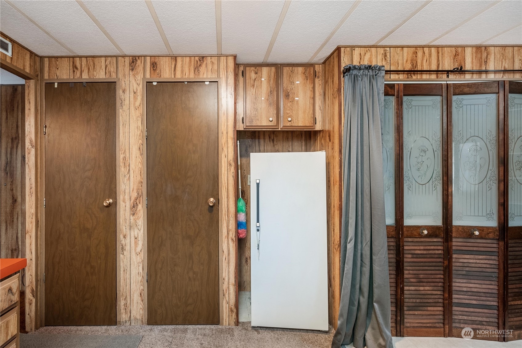 321 2nd Street Roy, WA 98580 - Photo 10 of 16 a view of a refrigerator and an entryway