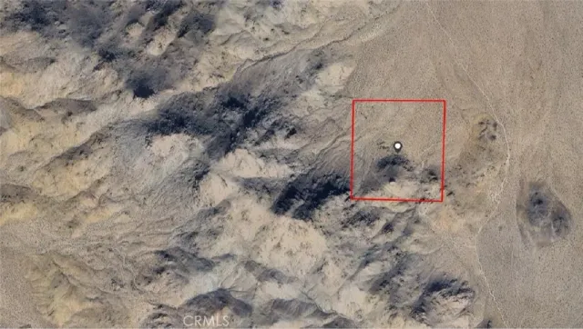 a aerial view of a house with a yard