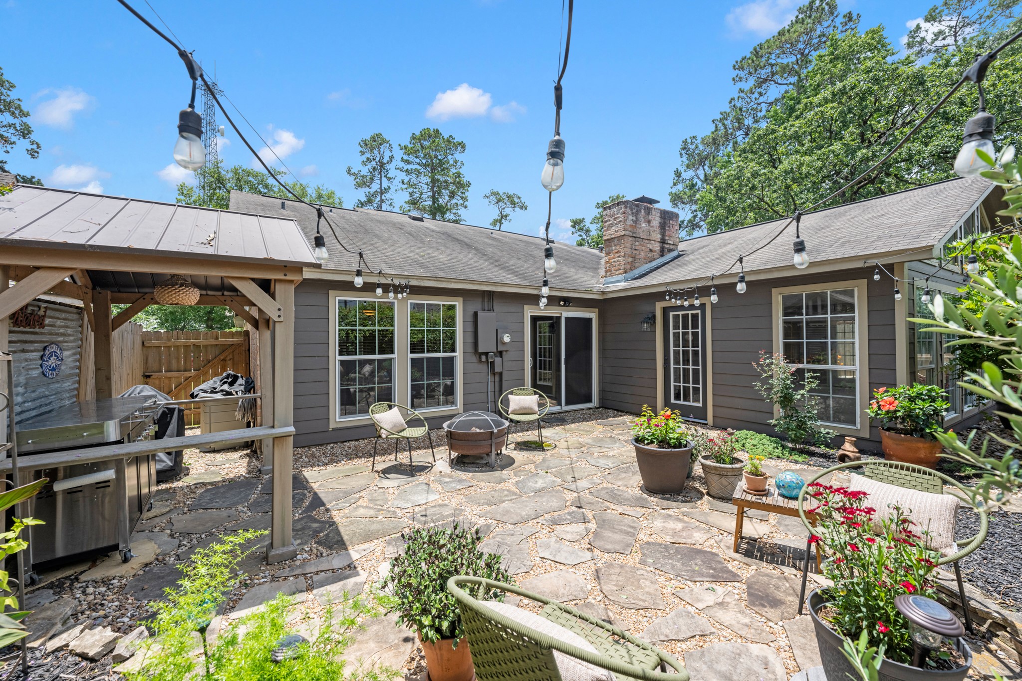 622 South Rivershire Drive Conroe, TX 77304 - Photo 5 of 44 a house view with sitting space and garden space