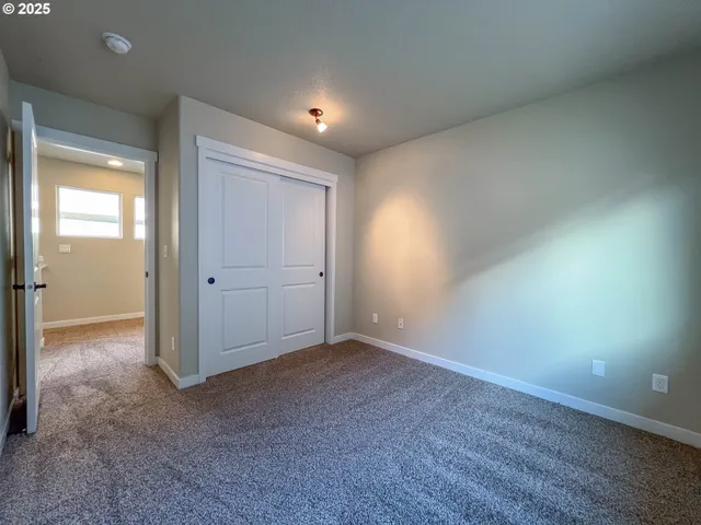 a open kitchen with a sink and dishwasher with wooden floor