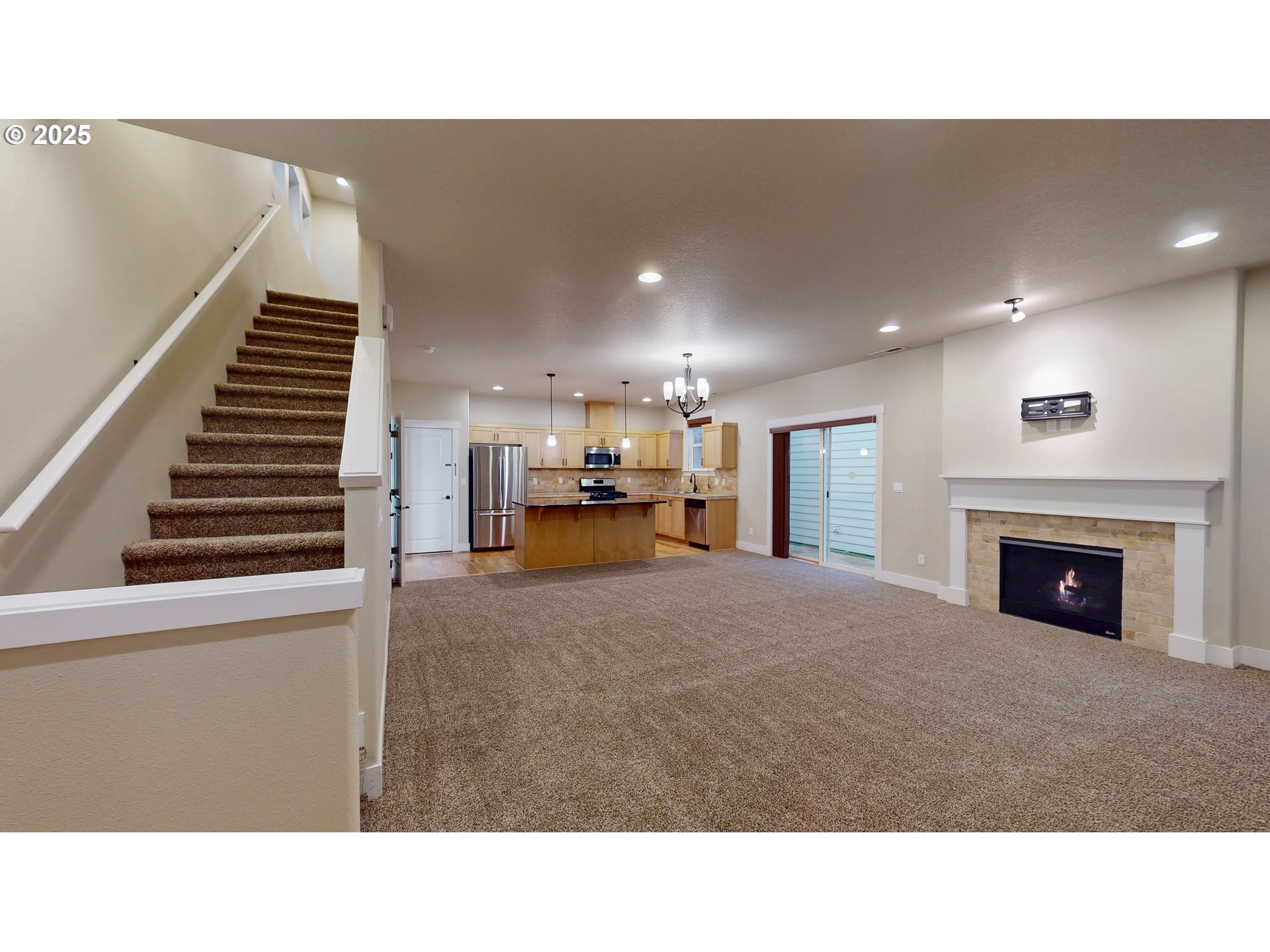 386 Southwest 203rd Terrace Beaverton, OR 97006 - Photo 2 of 24 a open kitchen with furniture and a fireplace