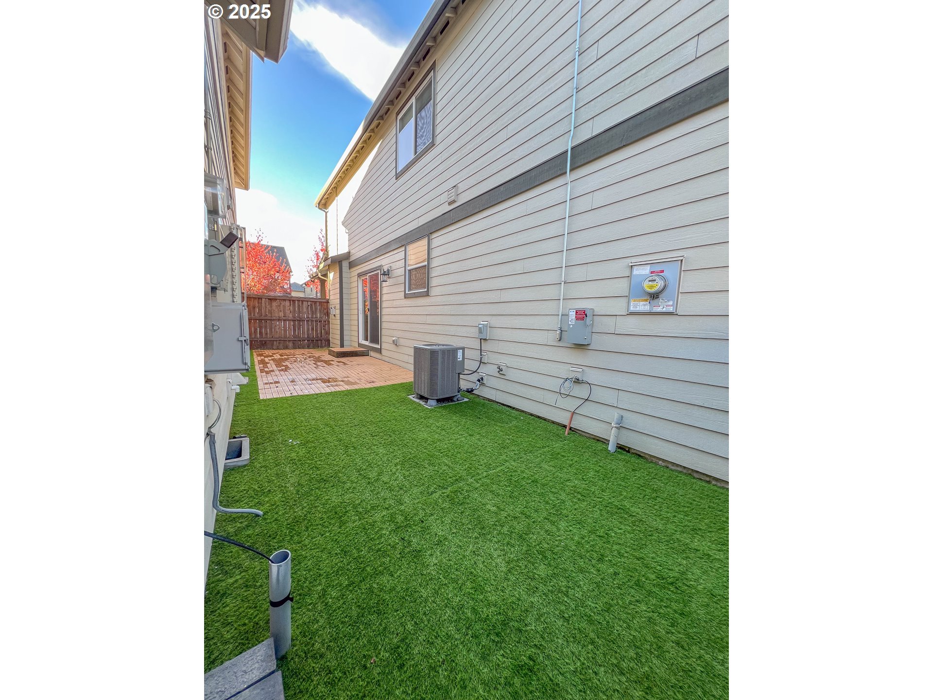 386 Southwest 203rd Terrace Beaverton, OR 97006 - Photo 8 of 24 a view of a backyard with couches plants and large tree