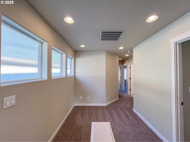 a view of hallway with a large window