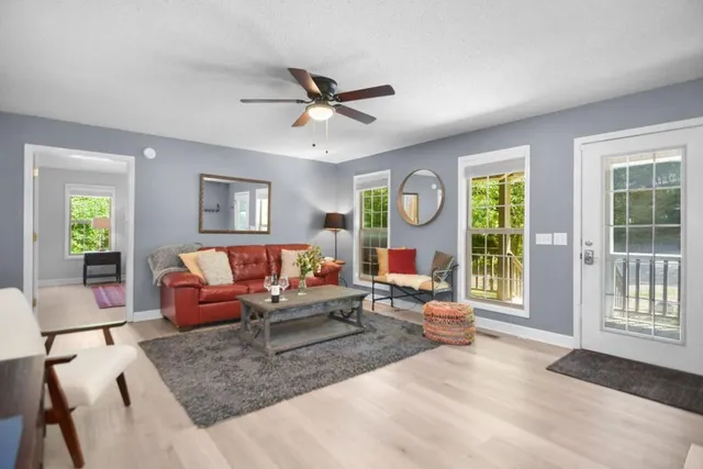 a living room with furniture and a window