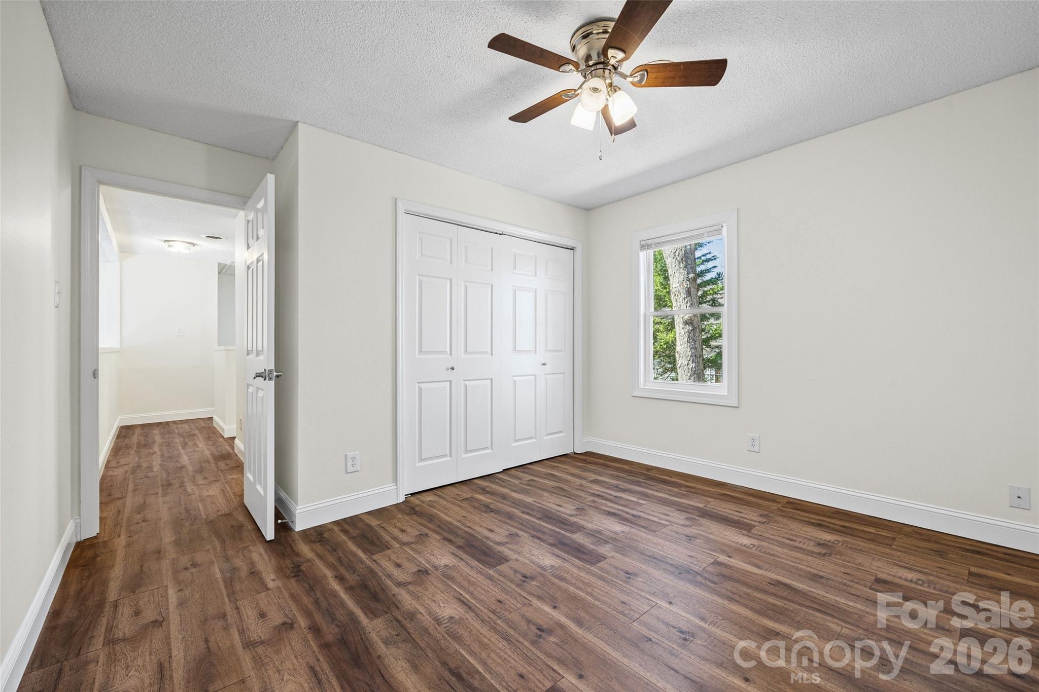 16149 Haroa Court Fort Mill, SC 29708 - Photo 19 of 43 a view of empty room with wooden floor and fan