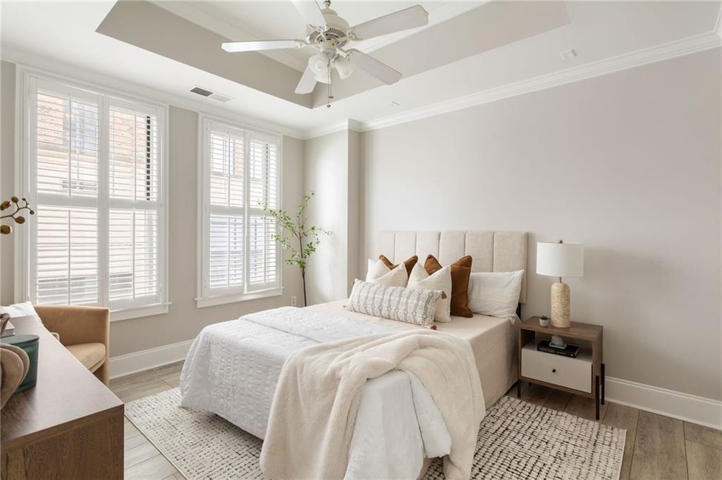 2255 Peachtree Road Northeast, Unit 326 Atlanta, GA 30309 - Photo 14 of 37 a bedroom with a bed and a couch