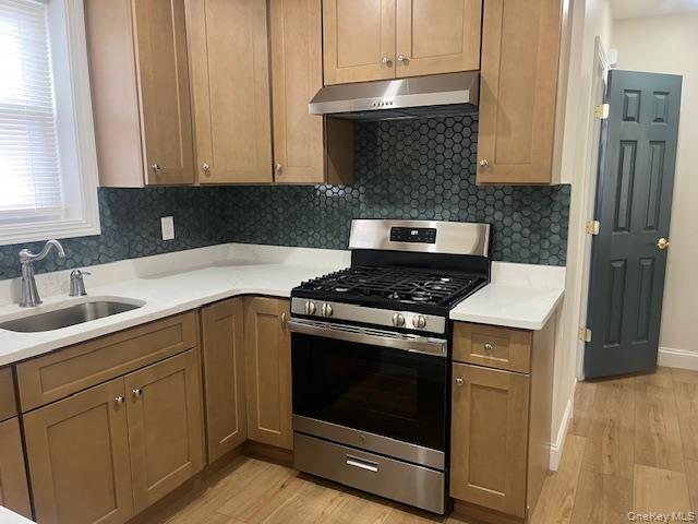 85-40 111th Street, Unit 2 Queens, NY 11418 - Photo 12 of 21 a kitchen with a stove and a sink