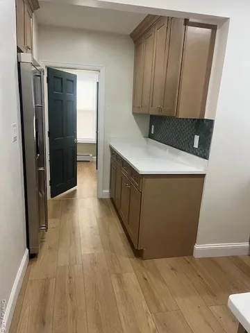 a storage room with wooden floor