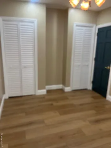 a view of a livingroom with wooden floor
