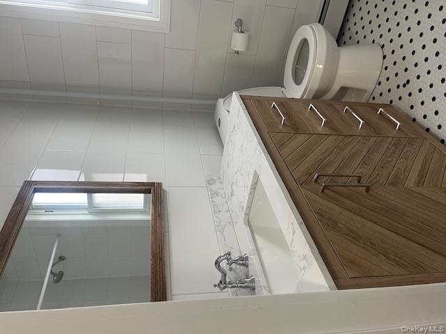 85-40 111th Street, Unit 2 Queens, NY 11418 - Photo 9 of 21 a bathroom with a sink toilet and mirror