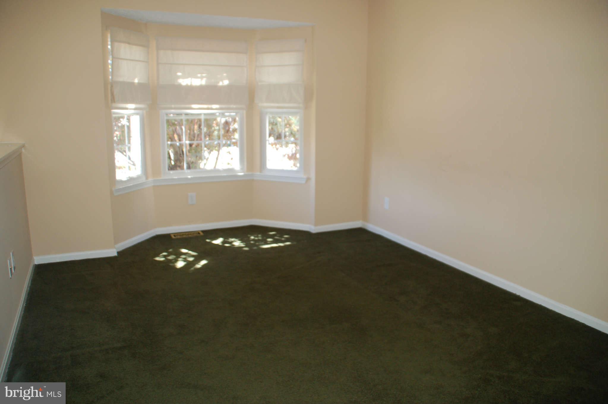 13982 New Braddock Road Centreville, VA 20121 - Photo 2 of 16 an empty room with a window