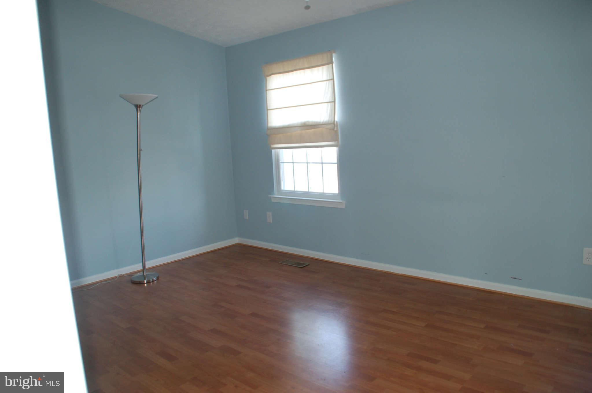 13982 New Braddock Road Centreville, VA 20121 - Photo 8 of 16 an empty room with wooden floor and window