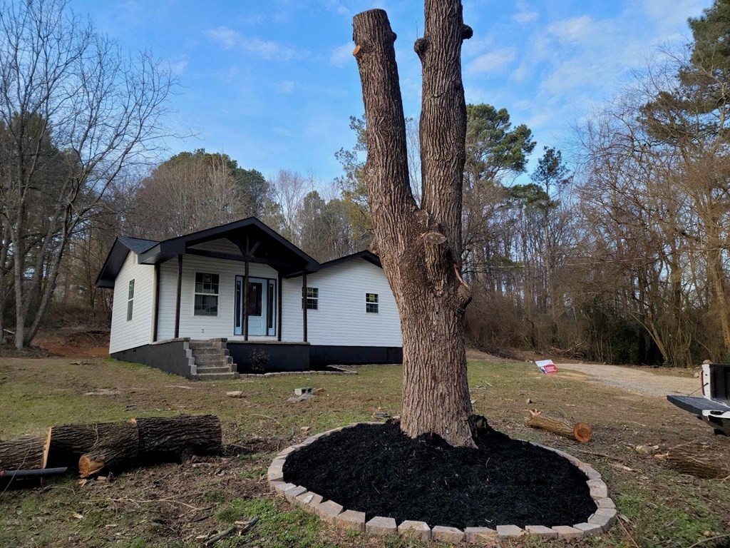 183 Hardy Street Resaca, GA 30735 - Photo 8 of 29 a front view of a house with a yard