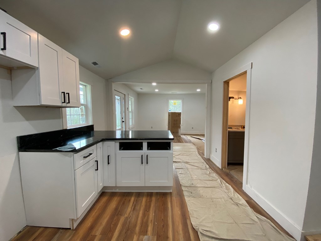 183 Hardy Street Resaca, GA 30735 - Photo 10 of 29 a kitchen with granite countertop a sink a counter top space stainless steel appliances and cabinets