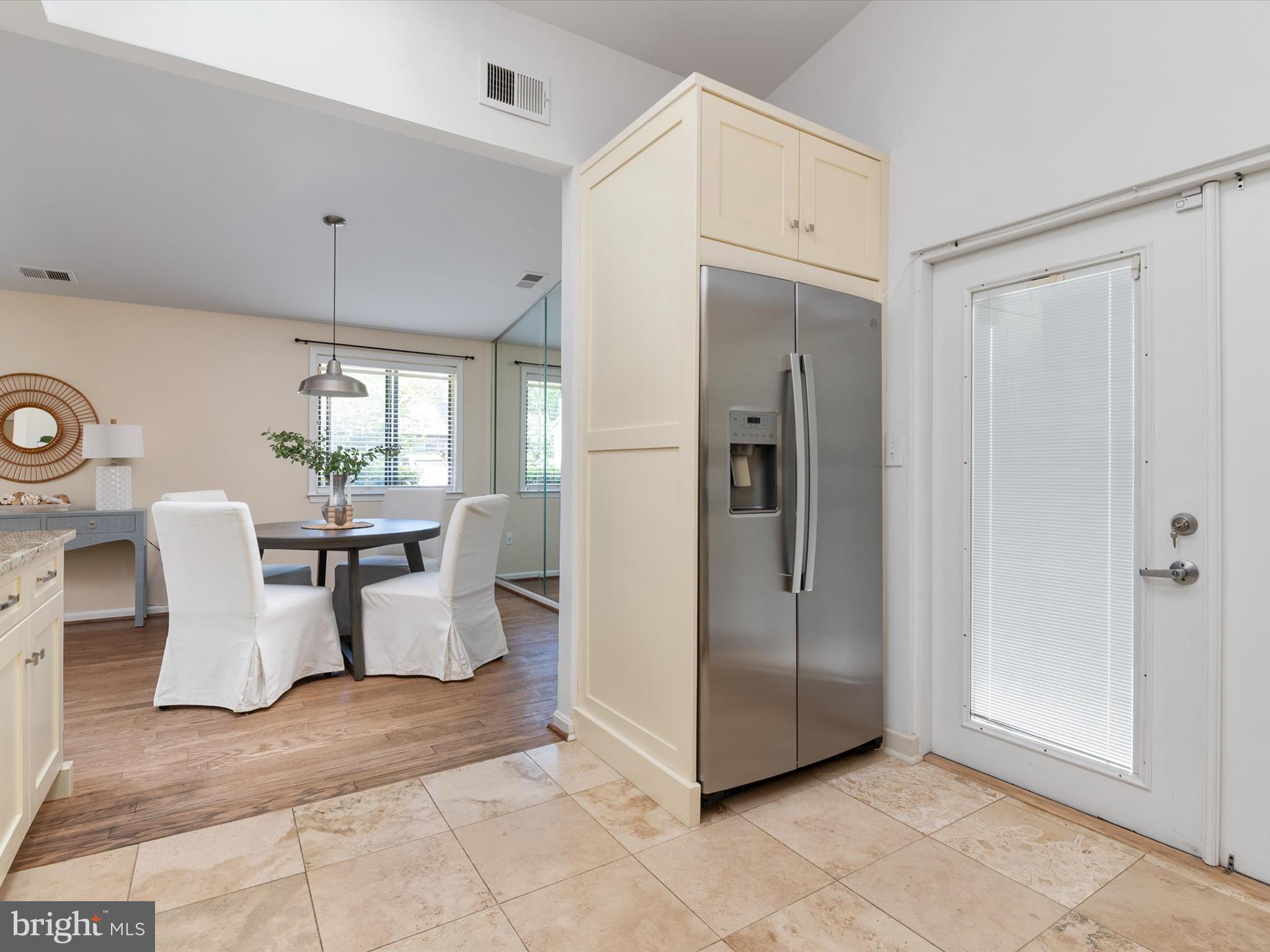 1411 Stonecreek Road Annapolis, MD 21403 - Photo 16 of 38 a view of a kitchen with dining area and refrigerator