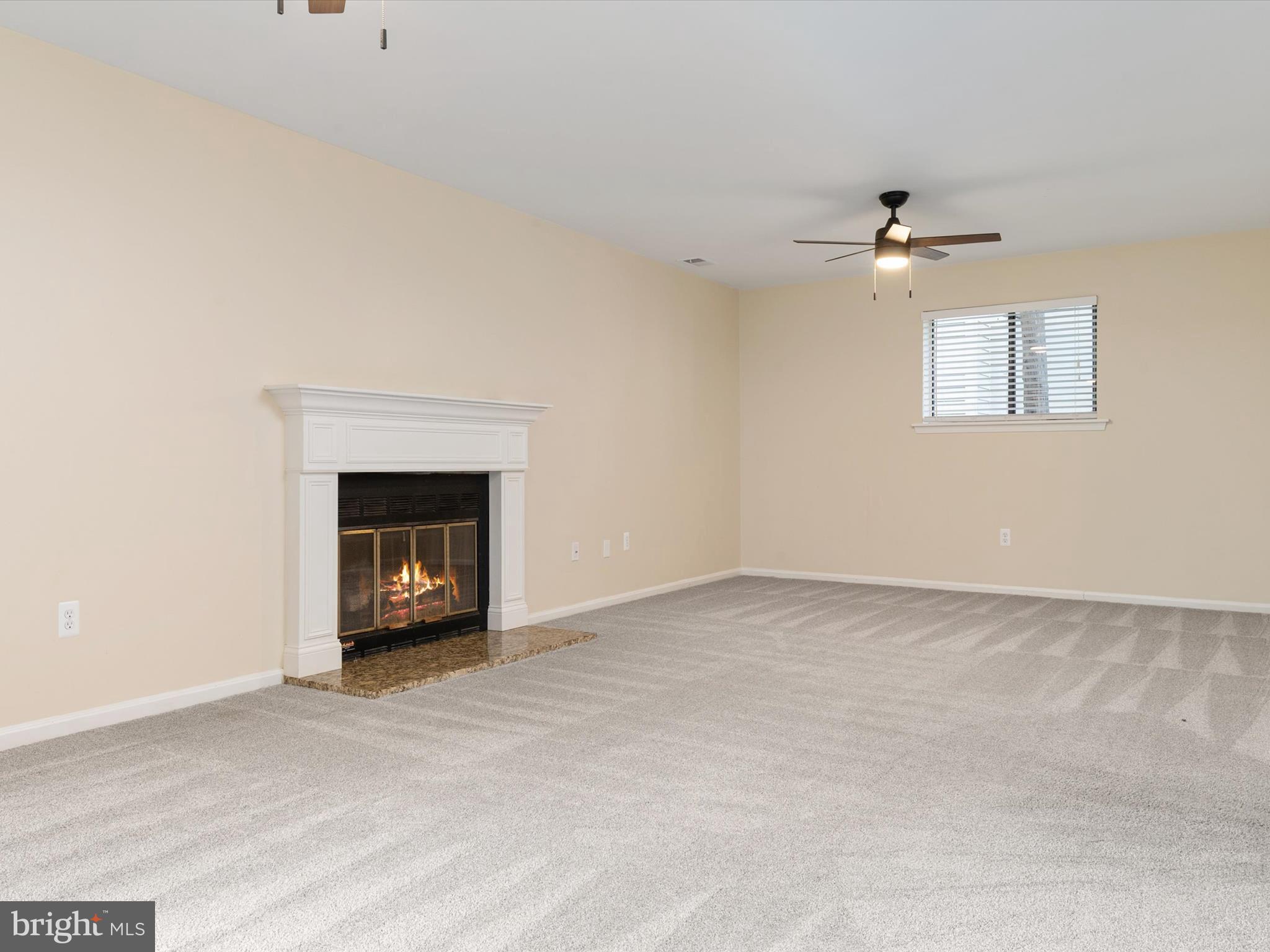 1411 Stonecreek Road Annapolis, MD 21403 - Photo 21 of 38 a view of an empty room with a fireplace