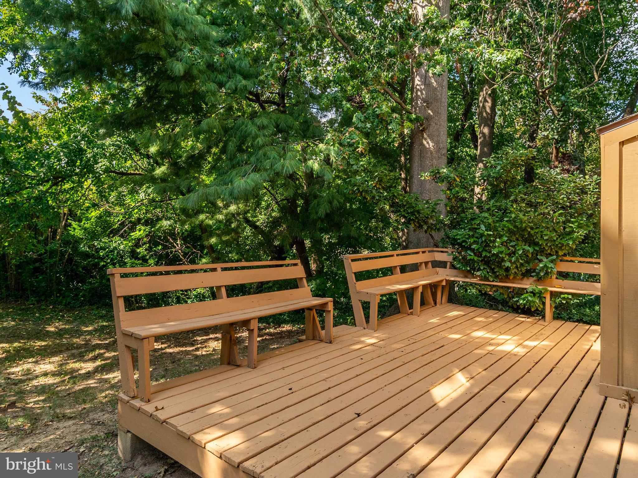 1411 Stonecreek Road Annapolis, MD 21403 - Photo 24 of 38 a view of a wooden deck with a bench