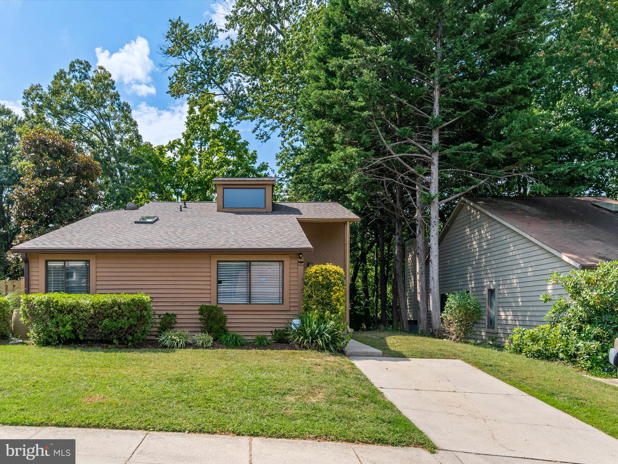 1411 Stonecreek Road Annapolis, MD 21403 - Photo 3 of 38 a front view of a house with a garden