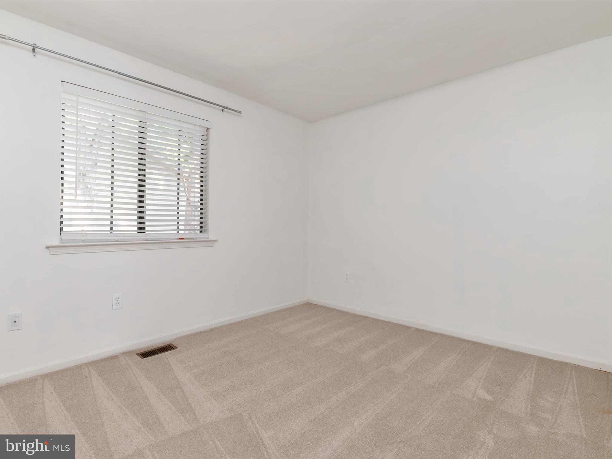 1411 Stonecreek Road Annapolis, MD 21403 - Photo 32 of 38 an empty room with a window