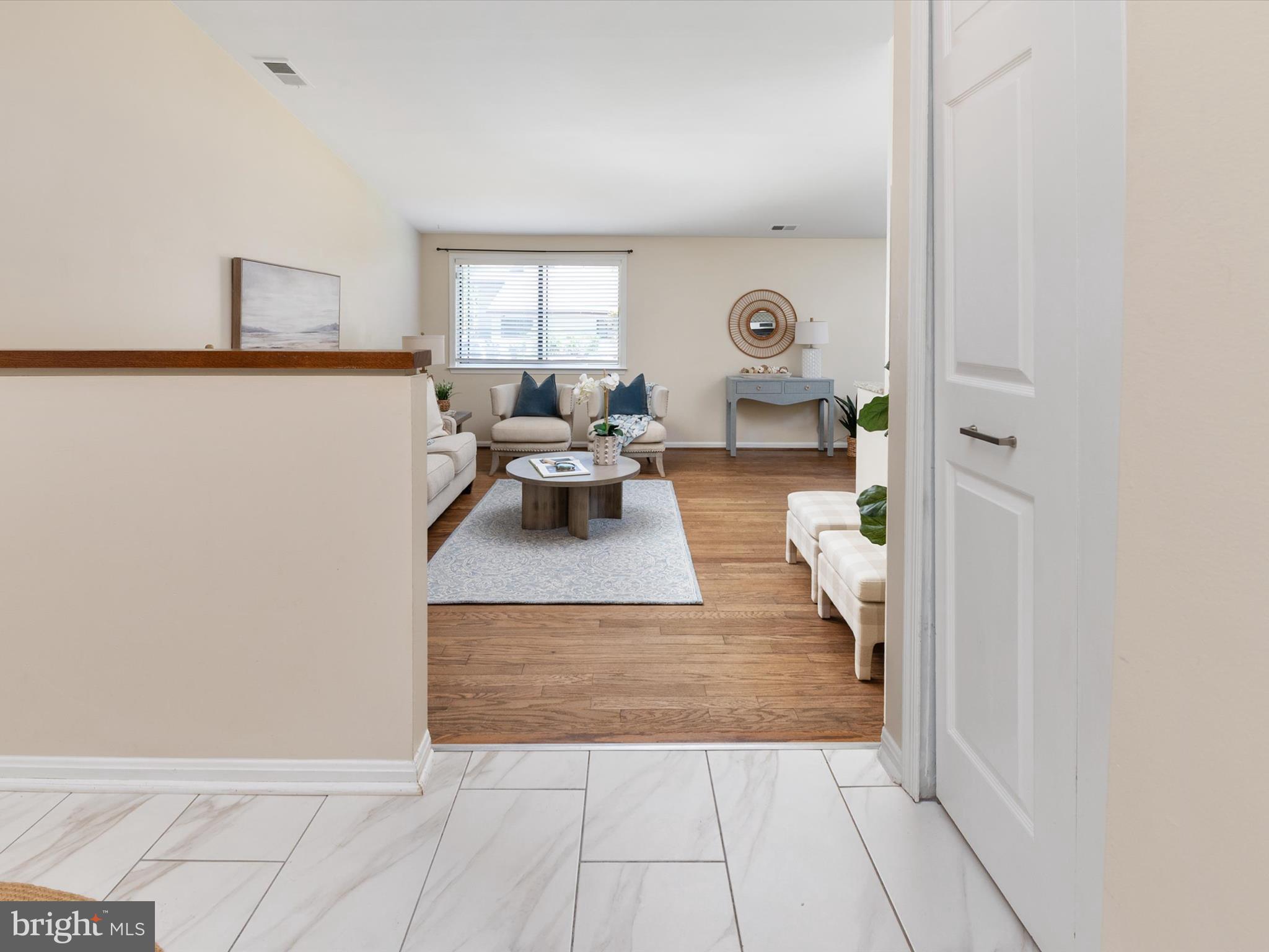 1411 Stonecreek Road Annapolis, MD 21403 - Photo 7 of 38 a living room with furniture and a table