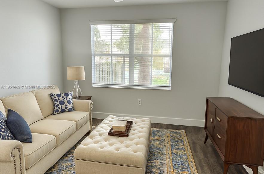 2933 Southeast 2nd Drive, Unit 2 Homestead, FL 33033 - Photo 22 of 38 a living room with furniture and a flat screen tv